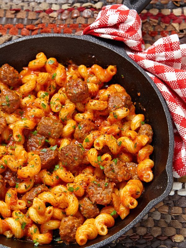 skillet with spanish chorizo pasta on a table cloth
