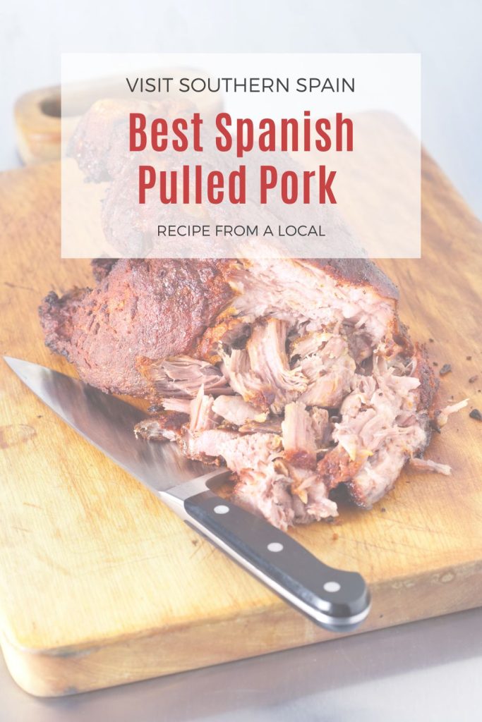 pulled pork on a wooden table. On top it's written Best Spanish pulled pork.