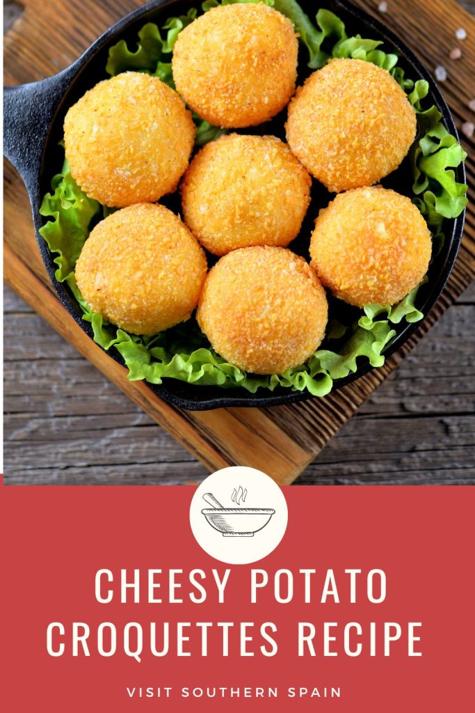 potatoe croquettes in a bowl served with salad on a wooden table. Under it it's written Cheesy potato croquettes recipe. 