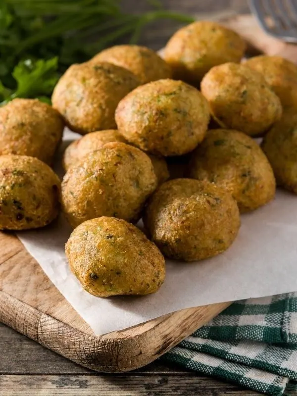 mackerel croquettes on a wooden plate