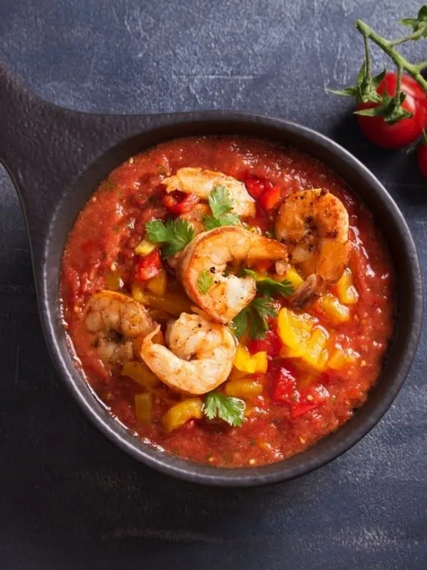 Gazpacho with Shrimp in a pot on a kitchen table.  25 Best Spanish Seafood Recipes to Try at Once!