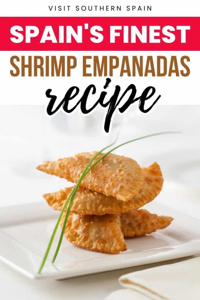Four pieces of empanada are stacked on a white plate. There are chives on top of them.