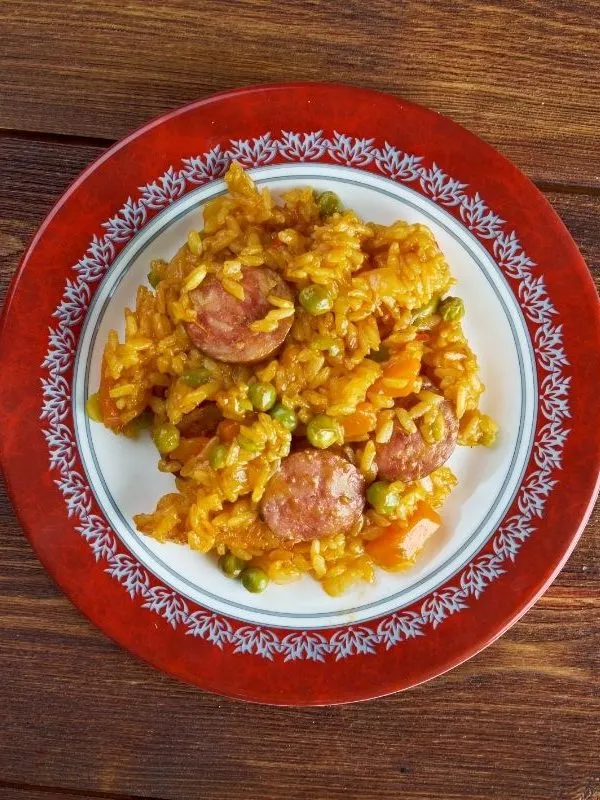 Spanish Chorizo Rice in a bowl on a wooden table