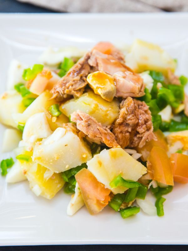 Spanish tuna salad on a white plate. 25 Best Spanish Seafood Recipes to Try at Once!