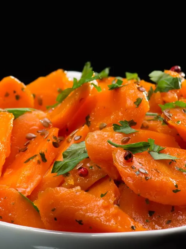 closeup with marinated carrots recipe in a white bowl