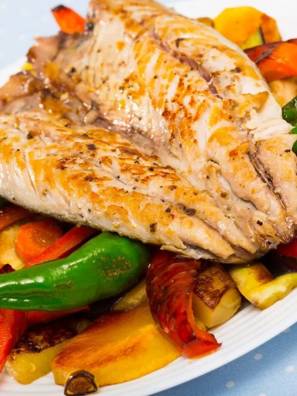 spanish Mackerel Fillet on baked vegetables. 25 Best Spanish Seafood Recipes to Try at Once!