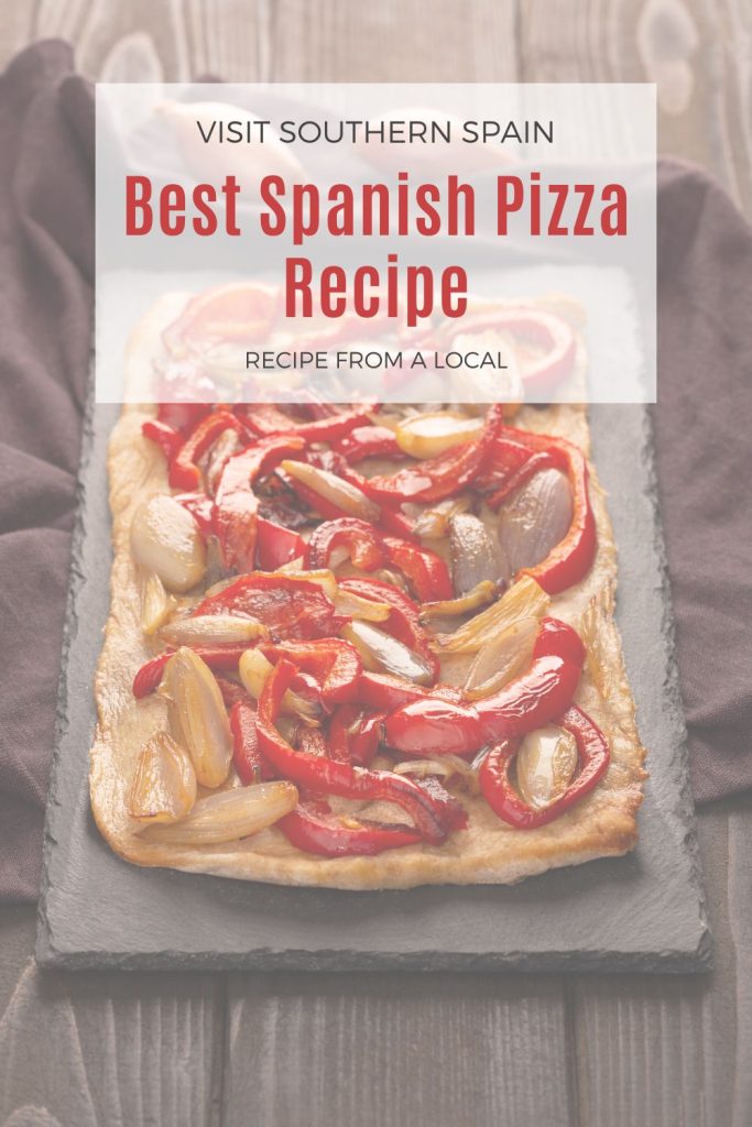spanish pizza on a black plate. On top it's written Best Spanish pizza recipe.