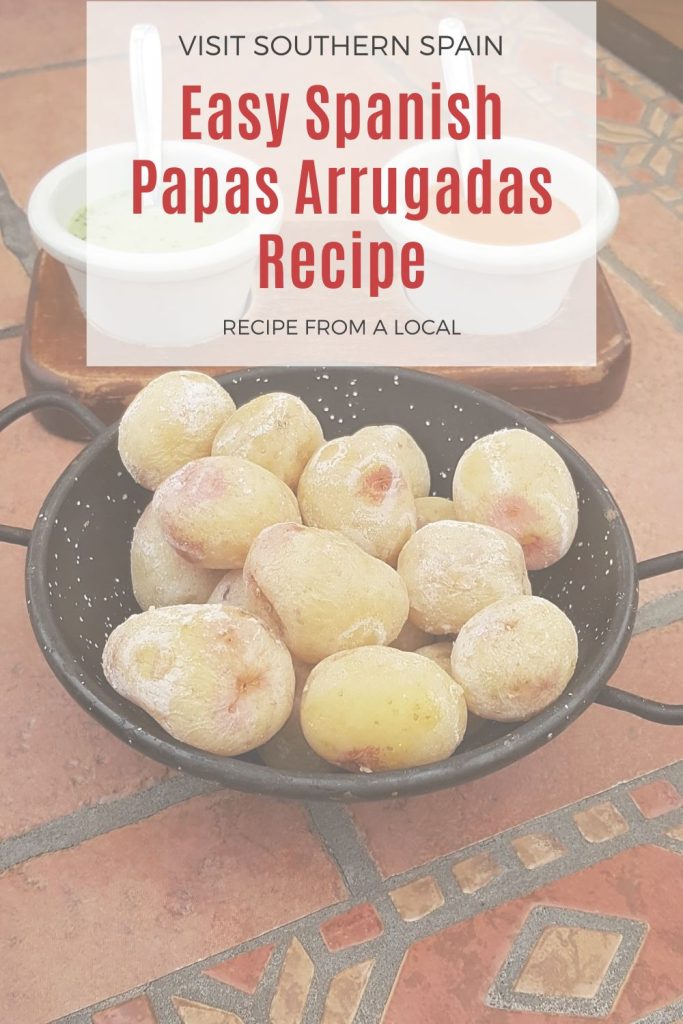 wrinkled potatoes served with sauces. On top it's written Papas arrugadas recipe. 