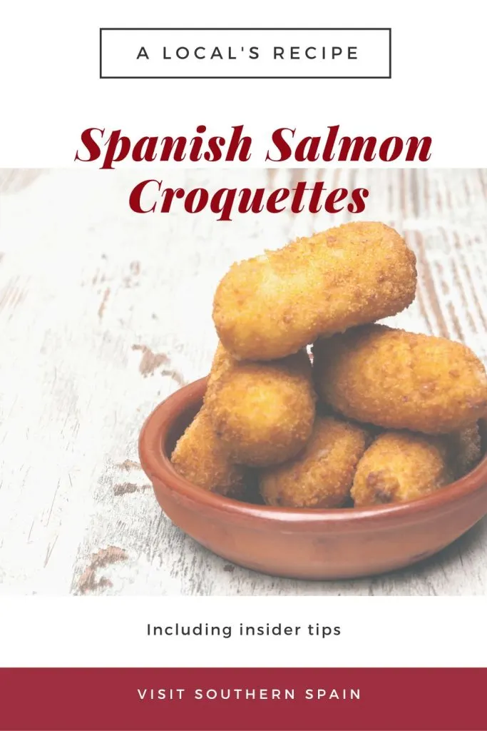 salmon croquettes in clay bowl. On top it's written Spanish salmon croquettes.