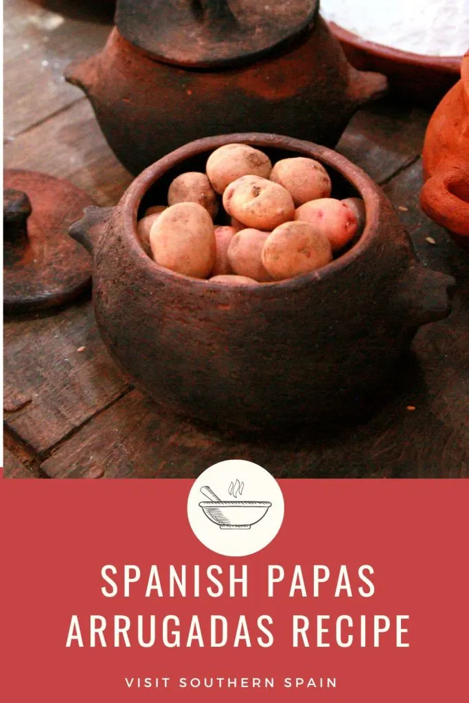 papas arrugadas in a wooden bowl. Under it's written Spanish papas arrugadas recipe.