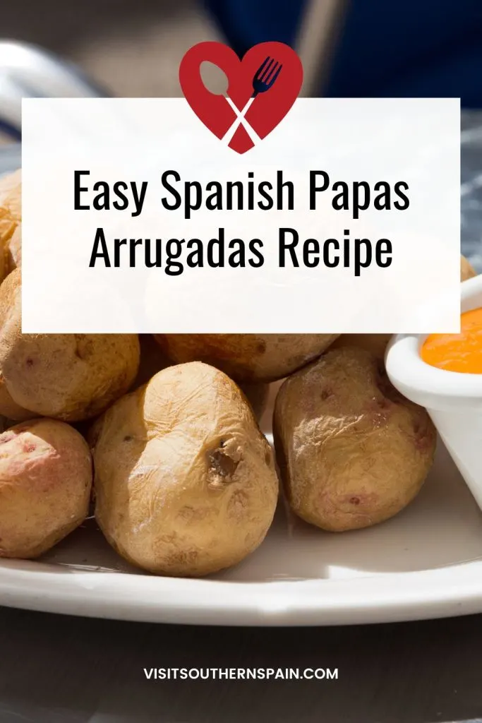 closeup with papas arrugadas served with sauce. On top it's written easy Spanish papas arrugadas recipe. 