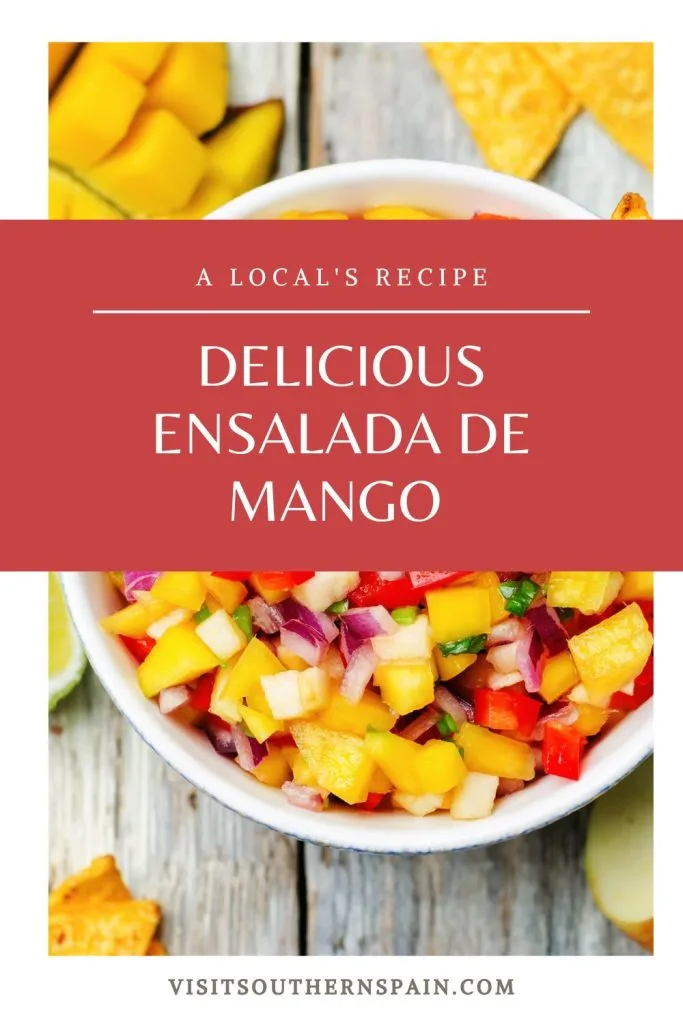 ensalada de mango in a white bowl. On top it's written Delicious ensalada de mango.