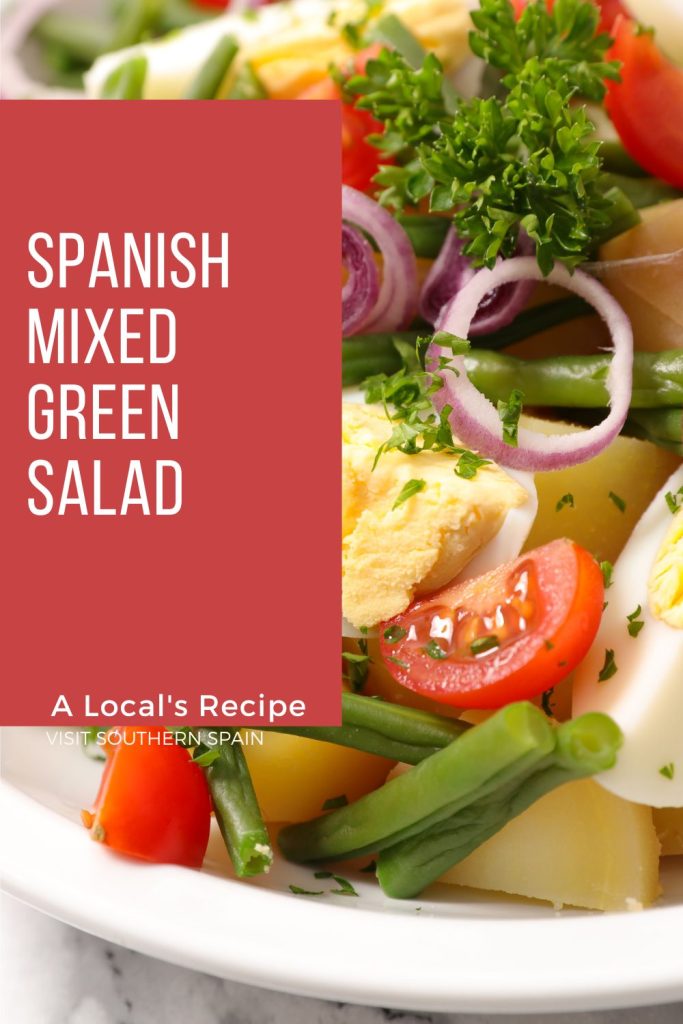 closeup with mixed green salad. On the left it's written spanish mixed green salad.