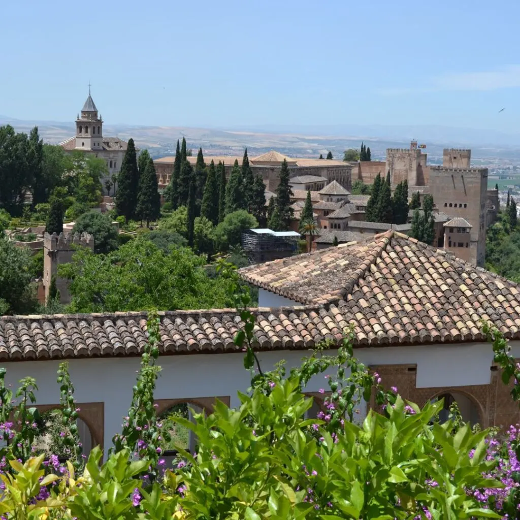 a view of Alhambra from Carmen de la Victoria filled with greenery