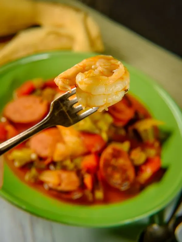 closeup with shrimp in a fork from the chorizo and shrimp recipe.