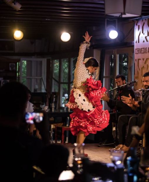 flamenco dancer at a bar in Malaga in July