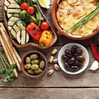 small selection of spanish vegetarian tapas on a wooden table