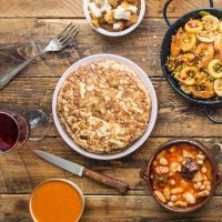 some of the best spanish recipe on a wooden table