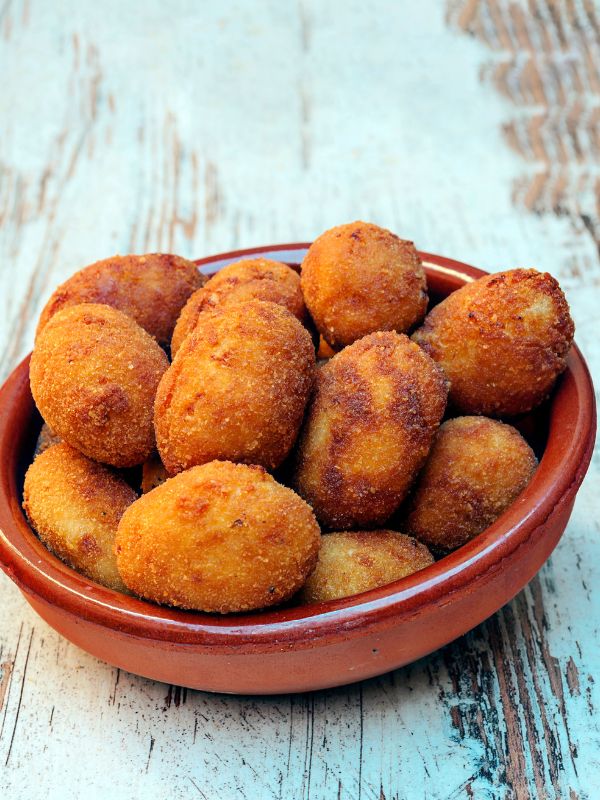 shrimp croquettes in a clay bowl.