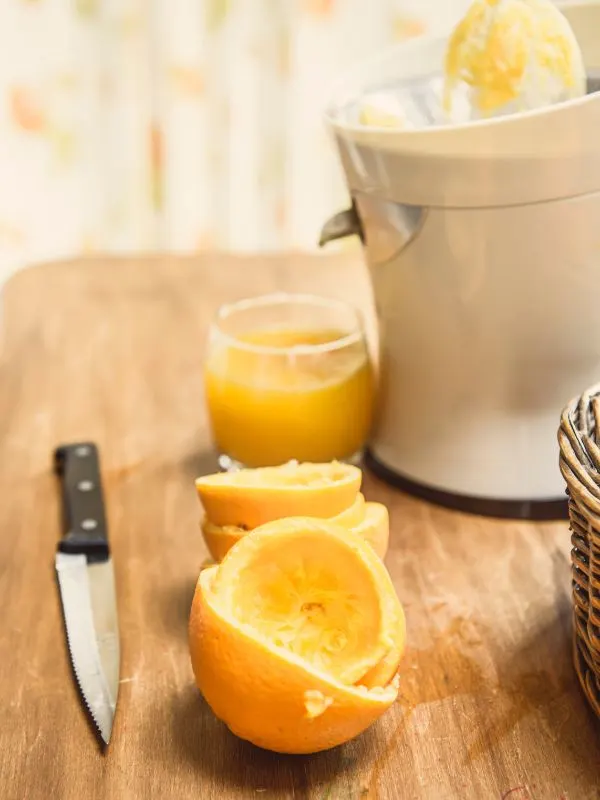 squeezing orange juice for the agua de valencia