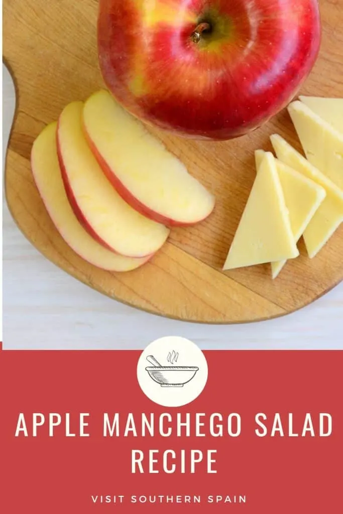 a pin with an apple and cheese on a wooden board. Under it's written apple manchego salad recipe.