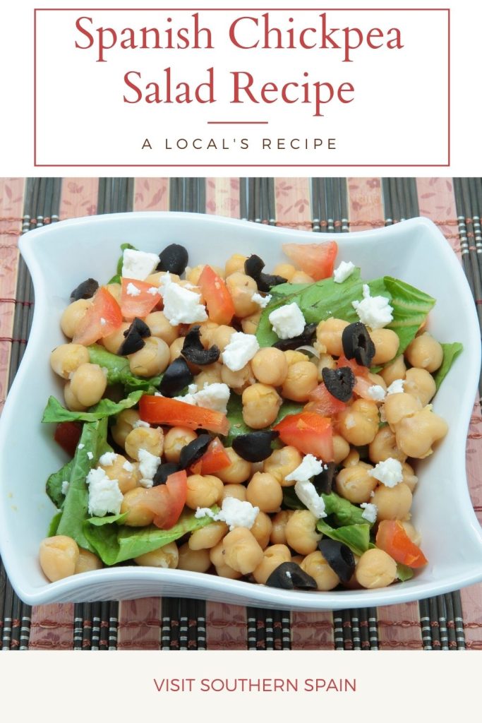 chickpea salad in a bowl. On top it's written spanish chickpea salad recipe.