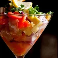 Spanish ceviche recipe in a glass decorated with lemon