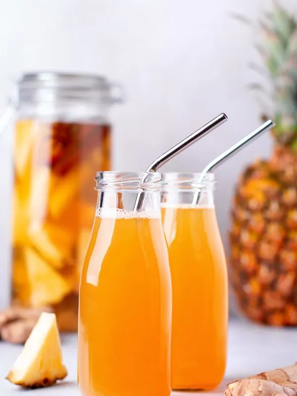 fermented pineapple juice, a fermented pineapple drink in 2 bottles.