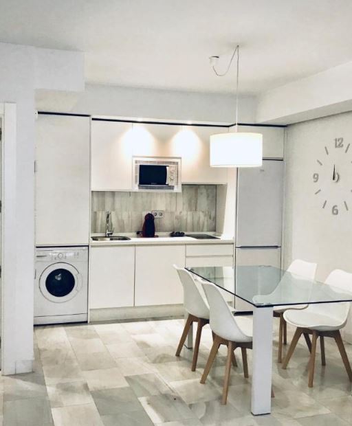 a kitchen at Domus Apartamentos Granada. 20 Best Cheap Hotels in Granada for 2023