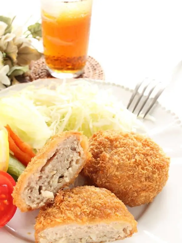 beef croquettes served with salad and beer