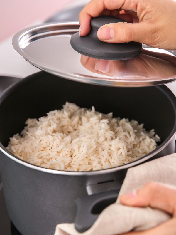 boiled rice in a pan for the spanish rice salad