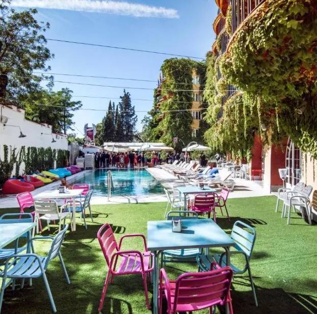 colorful garden and pool at Los Angeles Hotel & Spa, one of the best 4 star hotels in Granada