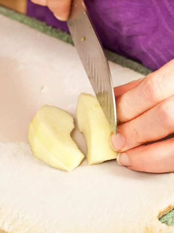 cutting an apple for the apple manchego salad.