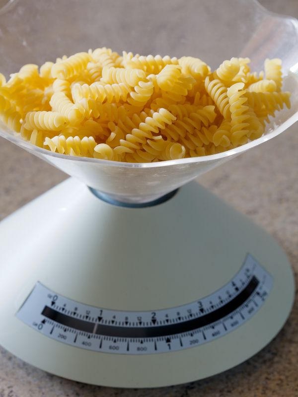 fusilli pasta on a kitchen scale for the spanish macaroni pasta recipe.