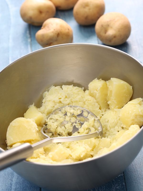 making spanish mashed potatoes in a bowl