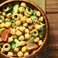 spanish chickpea salad in a wooden bowl.