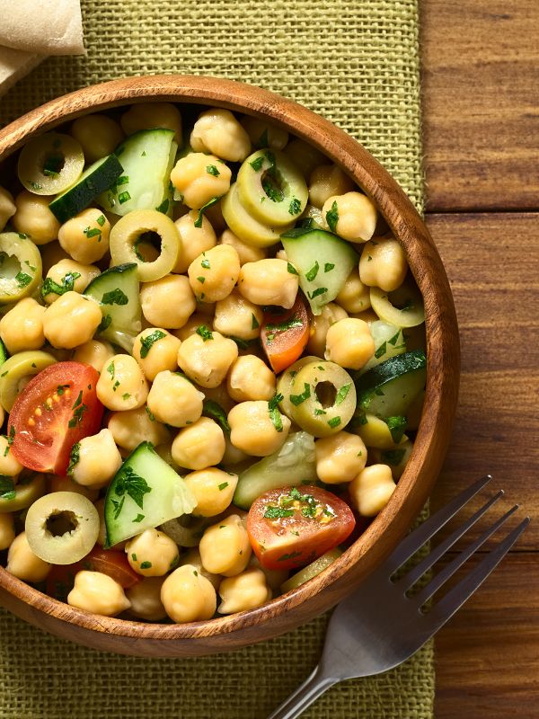 spanish chickpea salad in a wooden bowl.