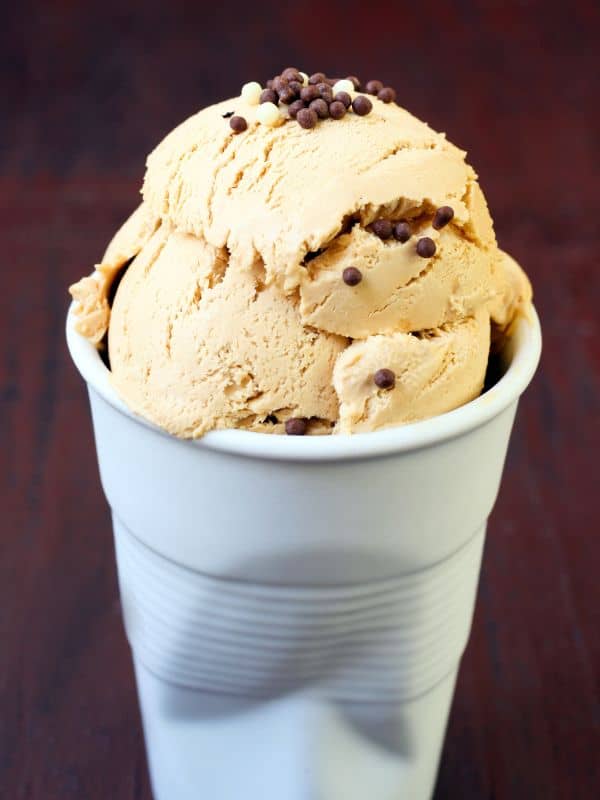 spanish ice cream in a cup with chocolate chips on top