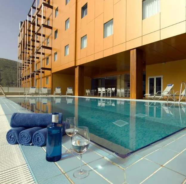the pool and outside of the Hotel Macià Real De La Alhambra, best 4 star hotels in granada