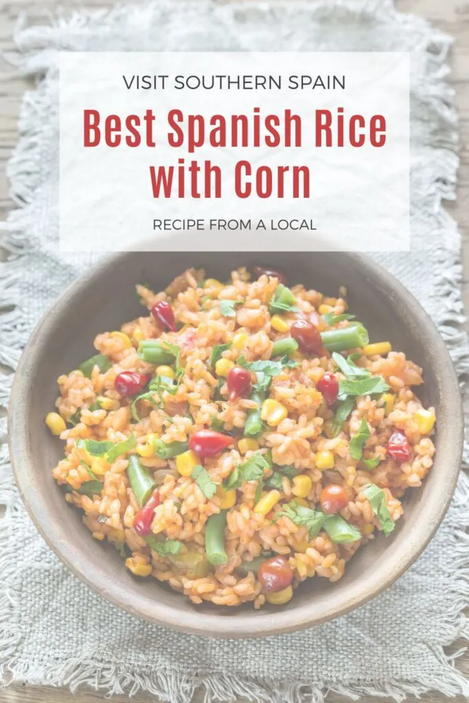 a pin with a bowl of spanish rice with corn.