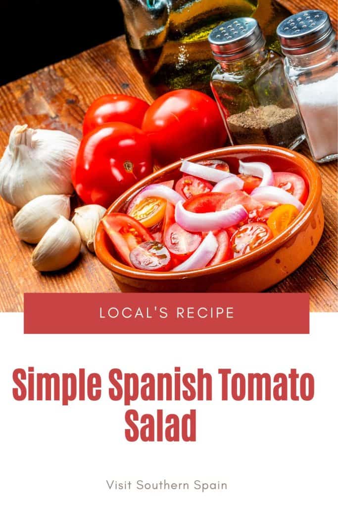 a pin with a Spanish tomato salad in a clay bowl with garlic and tomatoes next to it.