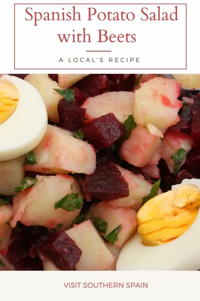 a pin with spanish potato salad with beets and boiled eggs.