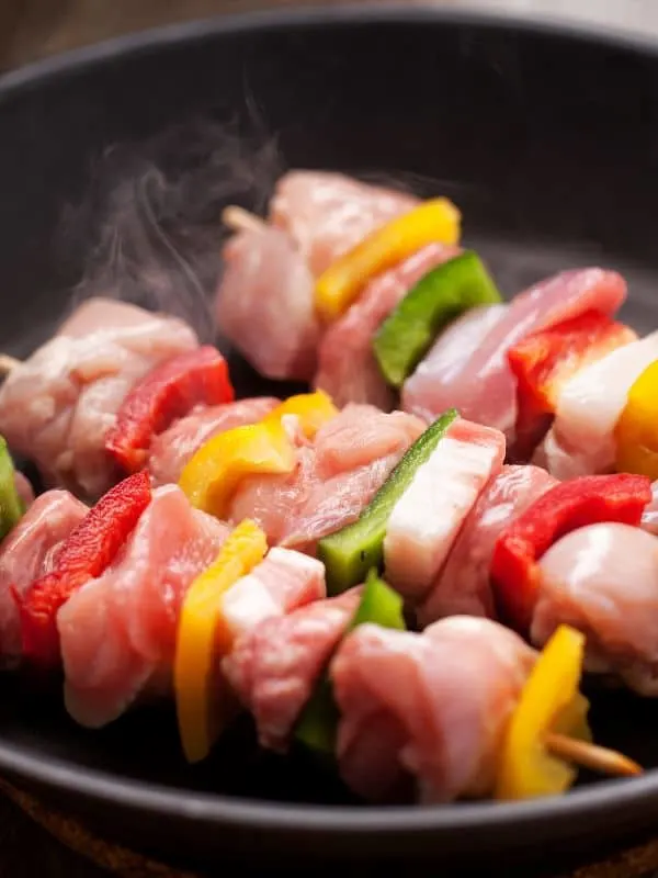 Spanish Chicken Skewers being cooked in a grill pan
