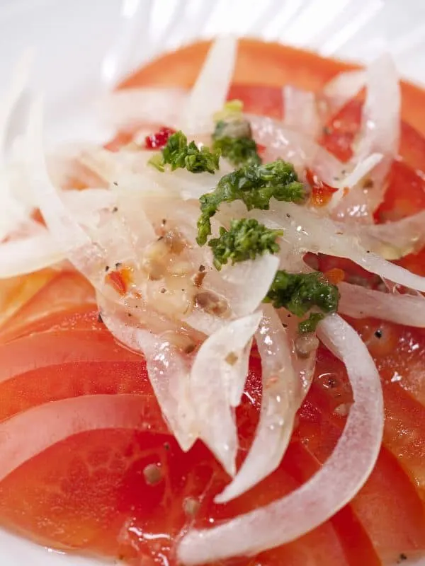 closeup with Spanish tomato salad with onion and olive oil