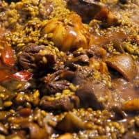 closeup with meat paella recipe from spain with beef and rice