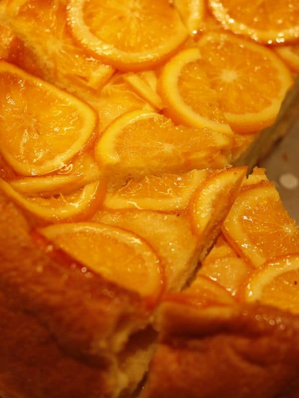 closeup with spanish orange cake with slices of orange on top