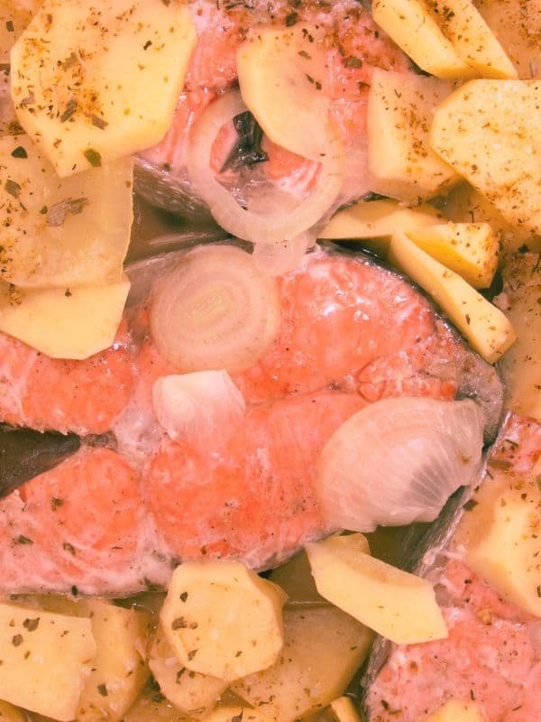 closeup with spanish salmon recipe with potato and onion