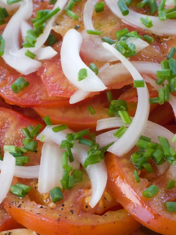 closeup with spanish tomato salad with onion and fresh parsley