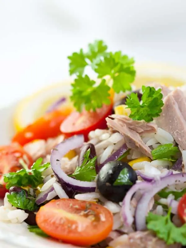 ensalada de bacalao with onion, tomatoes and olives.
