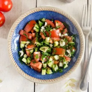 ensalada de pepino, spanish cucumber salad with tomato and onion in a bowl
